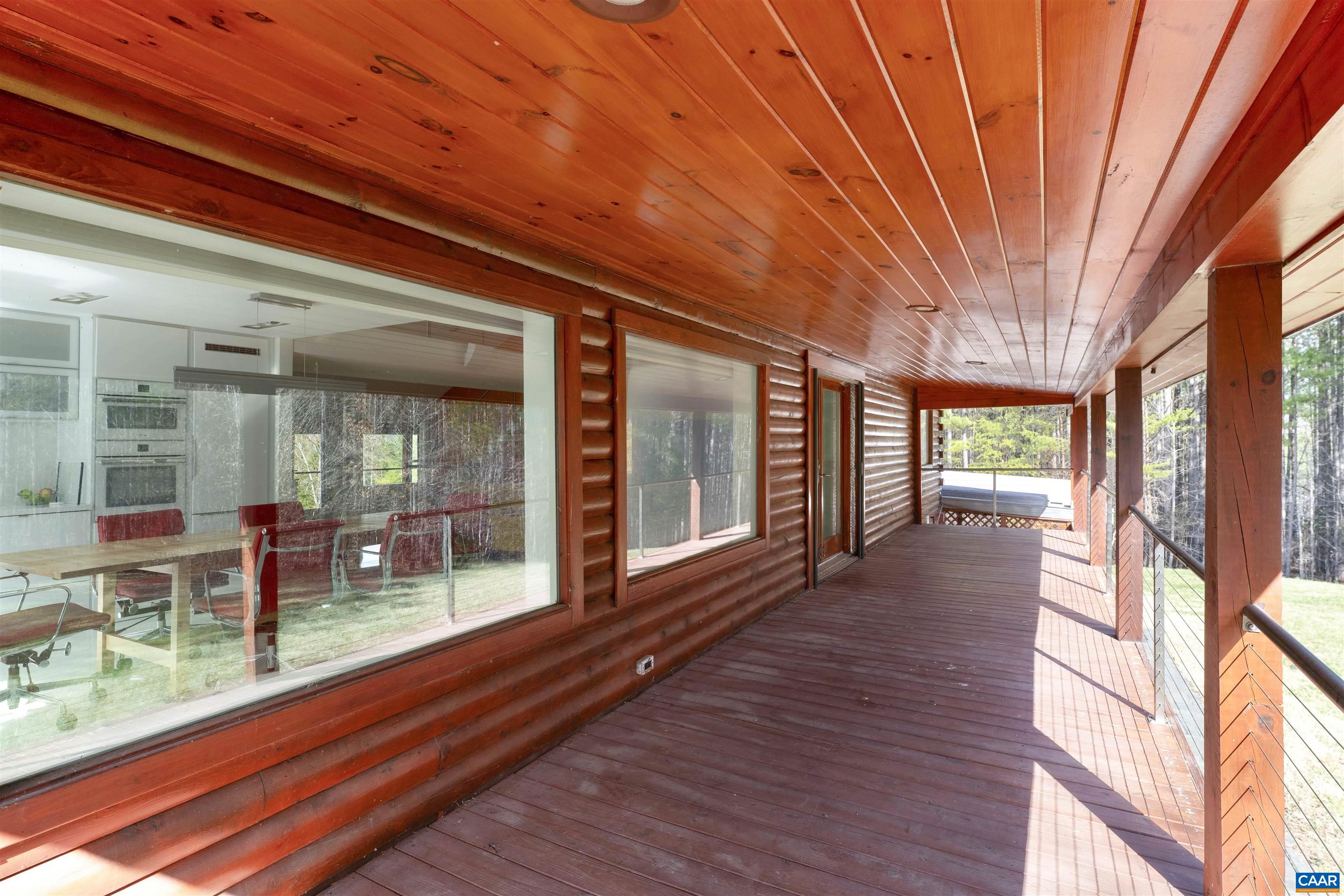4323 Carter Road Schuyler, VA 22969 - Photo 31 of 54 a view of a porch with wooden floor and outdoor seating