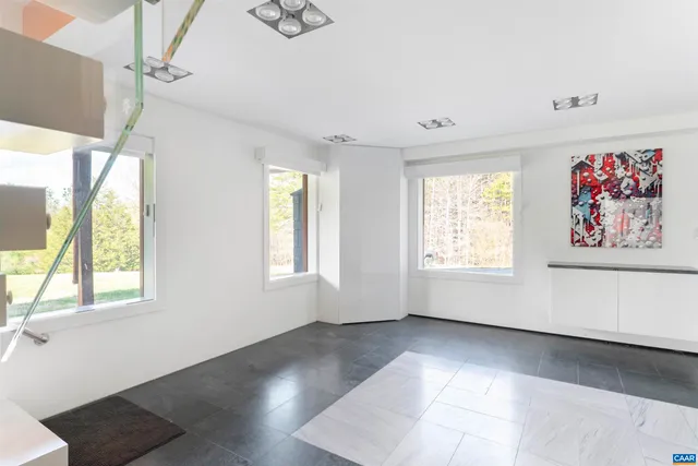 a view of an empty room with a balcony