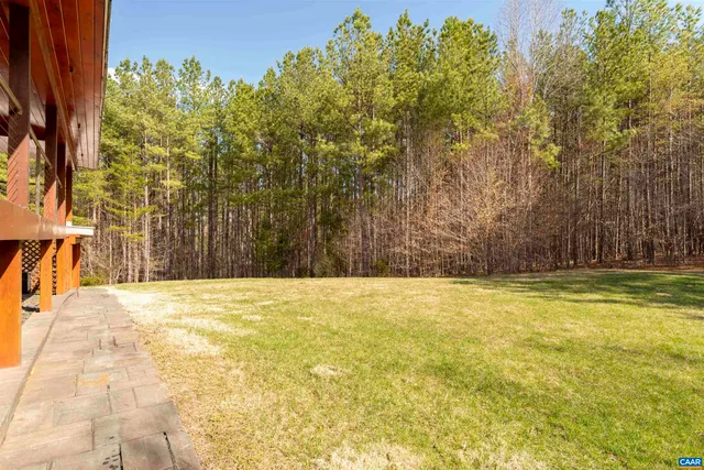 an aerial view of houses with yard