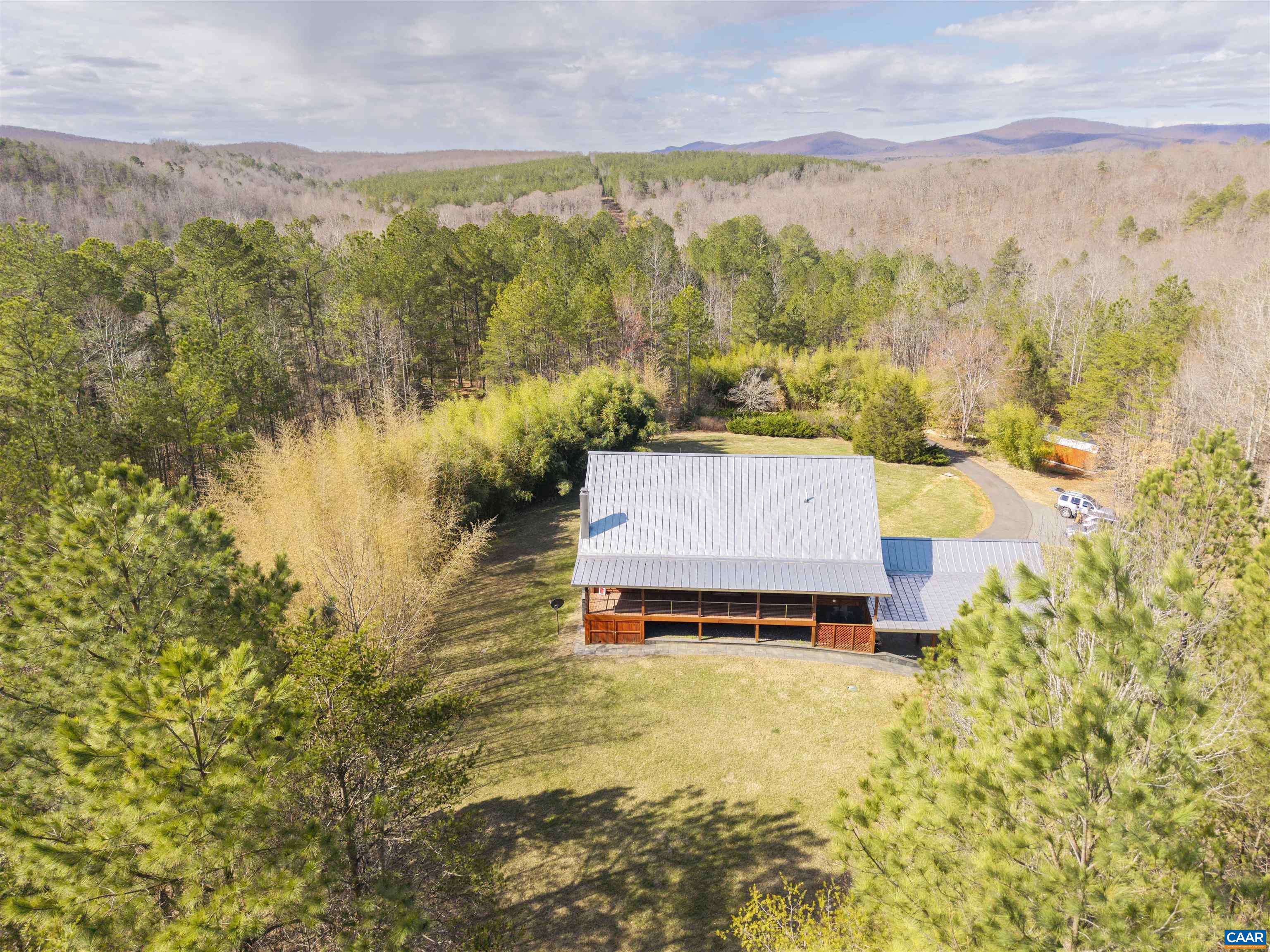 4323 Carter Road Schuyler, VA 22969 - Photo 5 of 54 a view of a lake with a mountain in the background