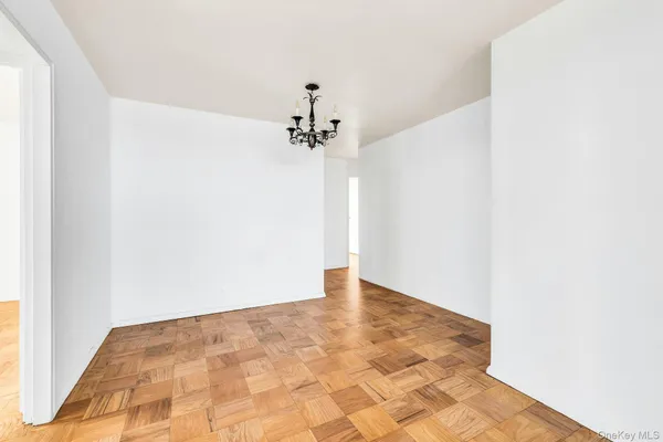 a view of a room with a ceiling fan