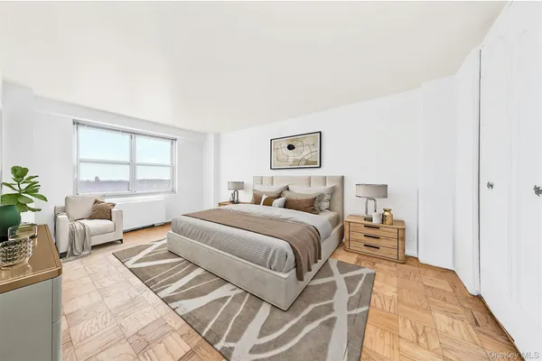 a bedroom with a large bed and a couch