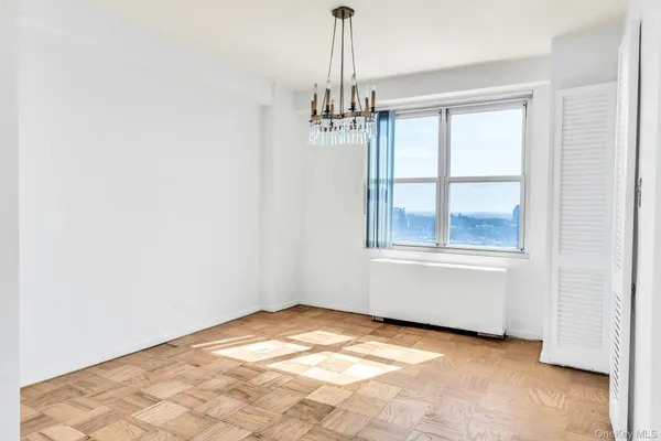 a view of an empty room with a window