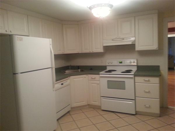 370 South Main Street Andover, MA 01810 - Photo 7 of 8 a kitchen with white cabinets and white appliances