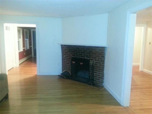 370 South Main Street Andover, MA 01810 - Photo 8 of 8 a view of an empty room with wooden floor and a fireplace