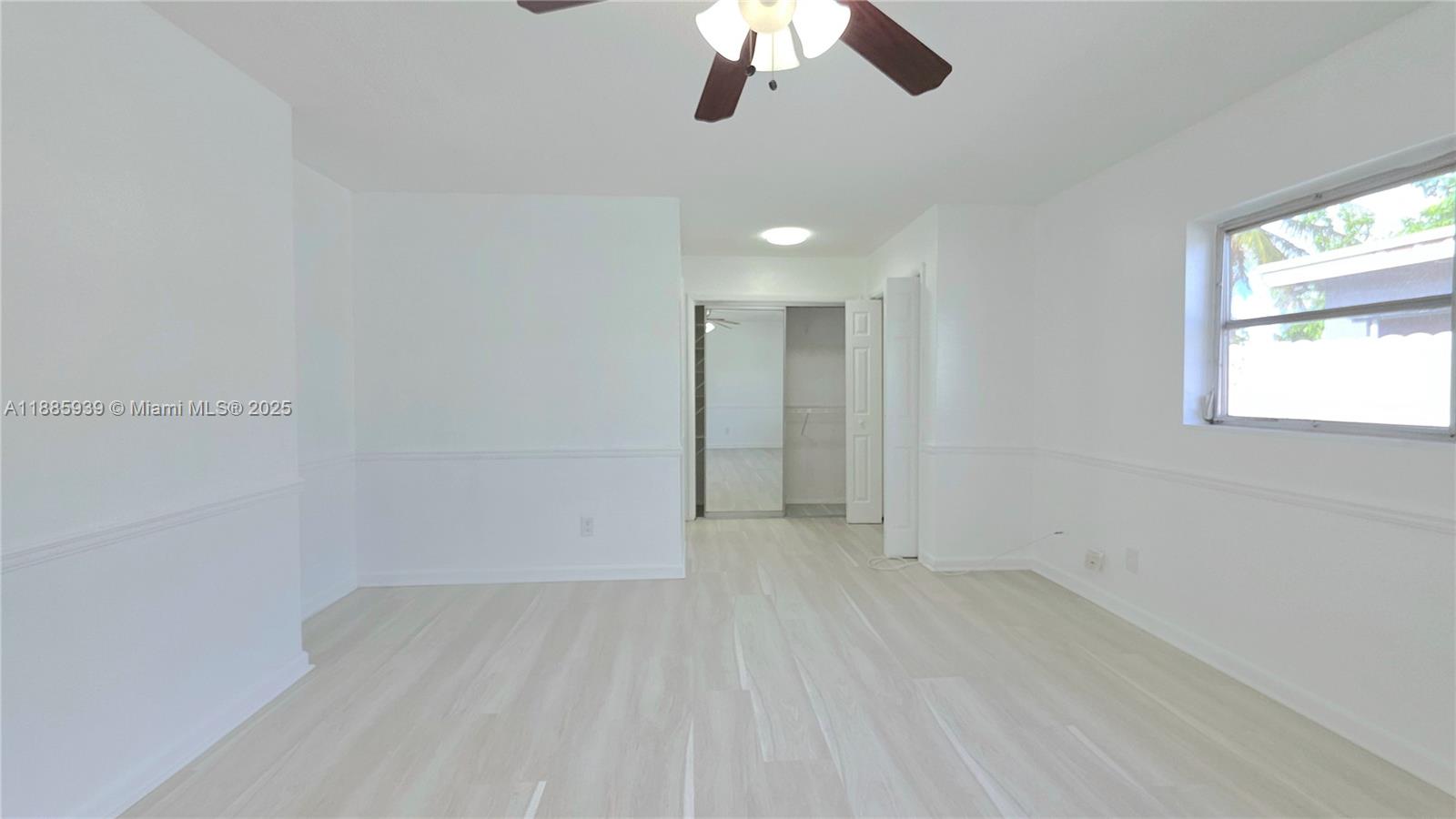 5300 Southwest 7th Court Margate, FL 33068 - Photo 16 of 18 wooden floor in an empty room with a window