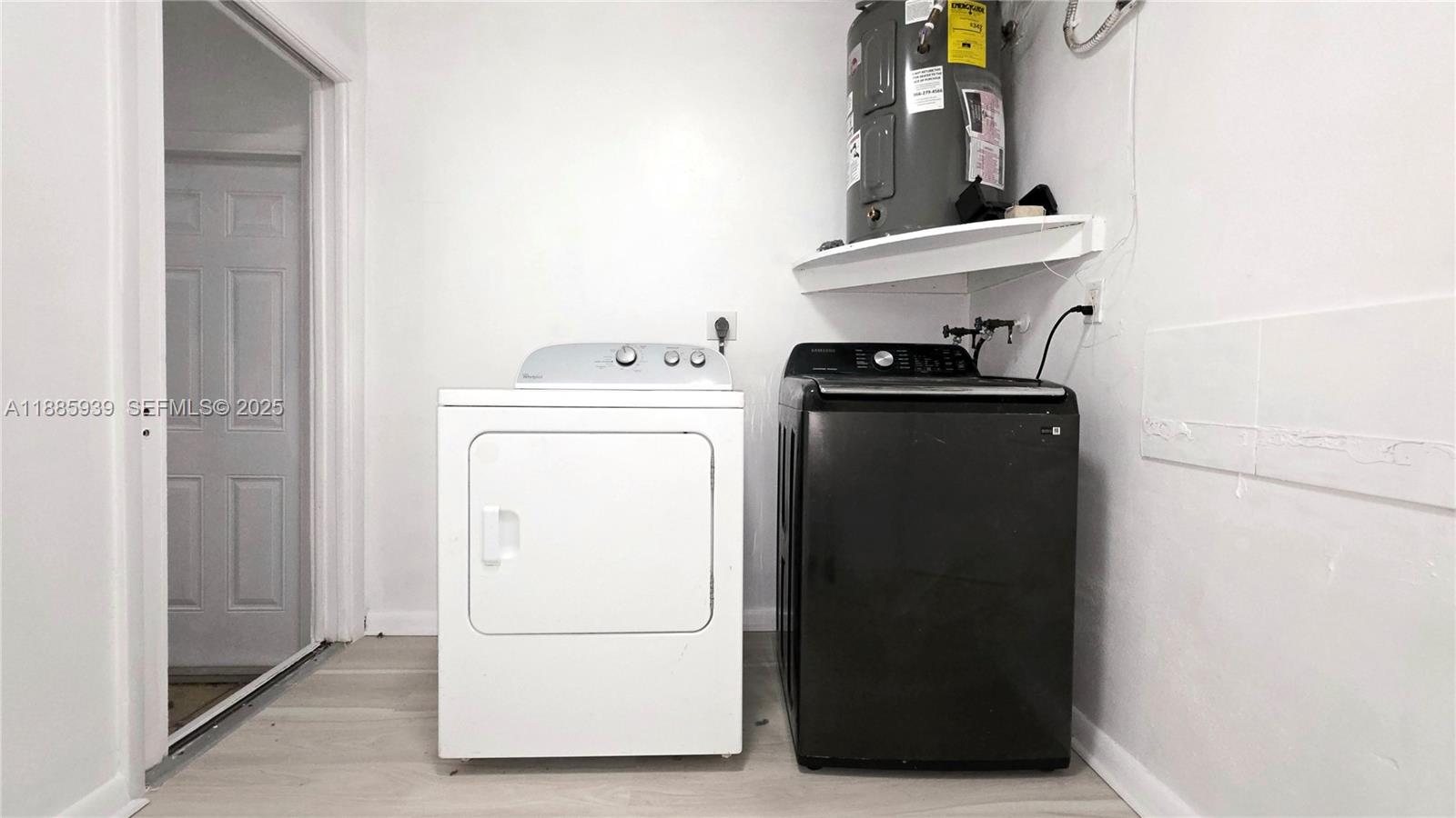 5300 Southwest 7th Court Margate, FL 33068 - Photo 18 of 18 a utility room with dryer and washer