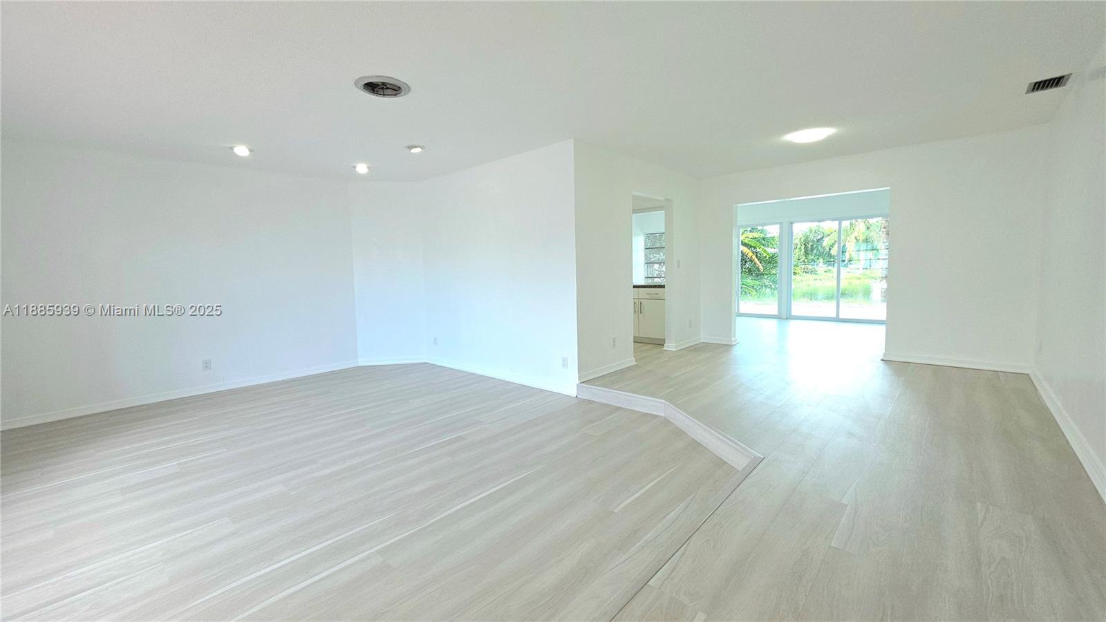 5300 Southwest 7th Court Margate, FL 33068 - Photo 3 of 18 a view of empty room with wooden floor and fan