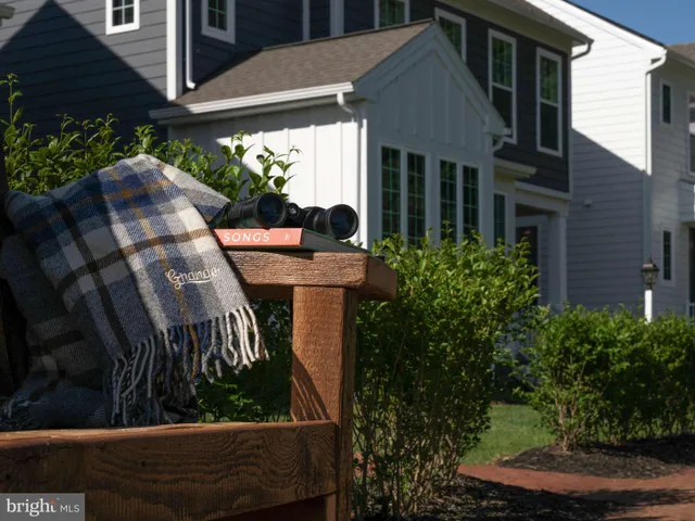 a view of a house with backyard porch and sitting area