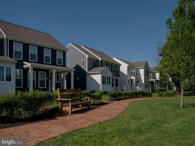 a front view of a house with a yard table and chairs