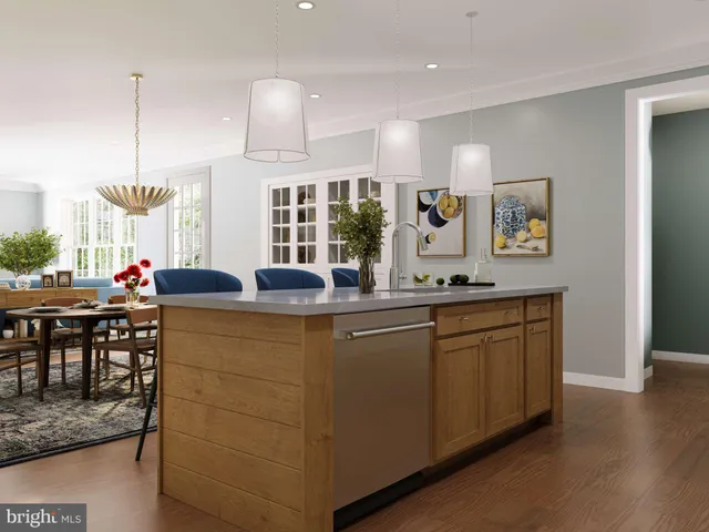 a kitchen with granite countertop a stove a sink a dining table and chairs