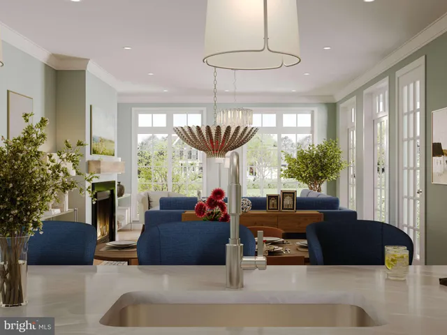 a living room with furniture a chandelier and a large window