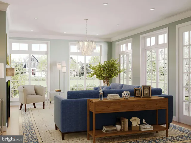 a living room with furniture and a floor to ceiling window