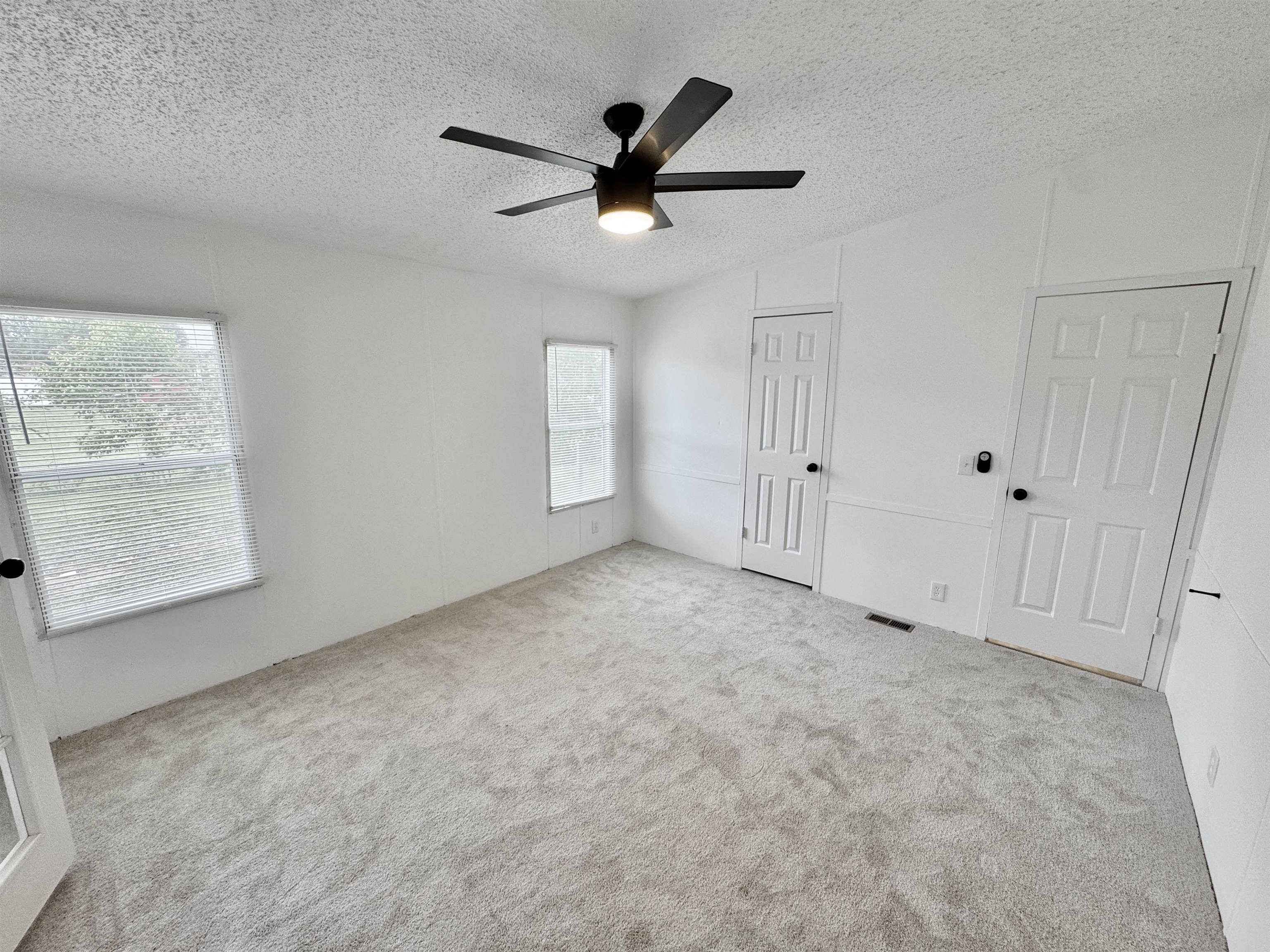 841 Simmons Road Drummonds, TN 38023 - Photo 15 of 35 Unfurnished bedroom with a textured ceiling, carpet floors, a closet, and a ceiling fan