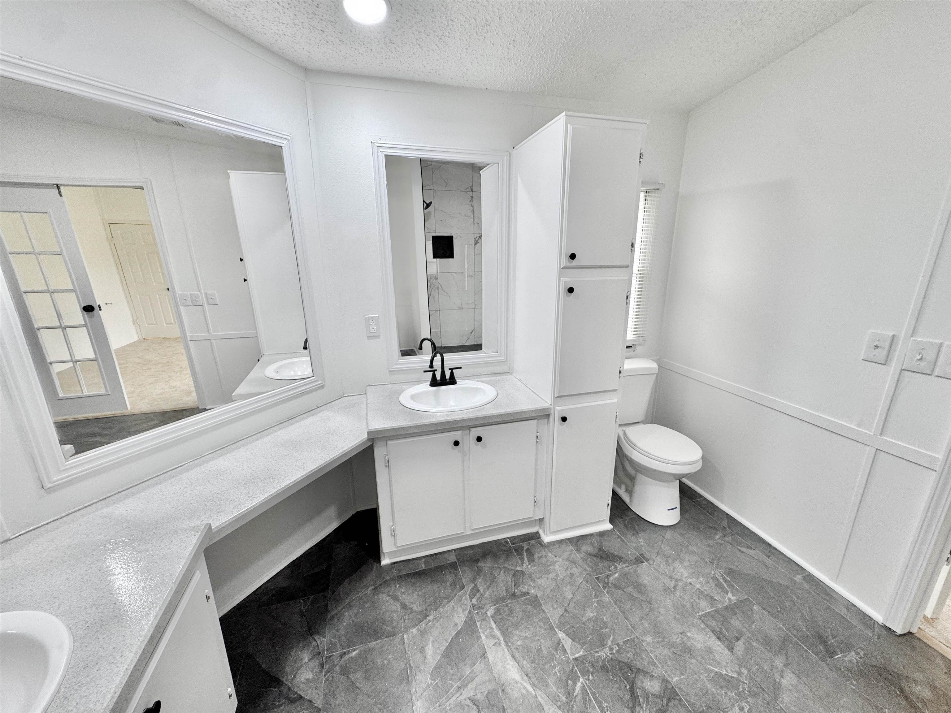 841 Simmons Road Drummonds, TN 38023 - Photo 17 of 35 Full bath with a textured ceiling, toilet, vanity, and baseboards