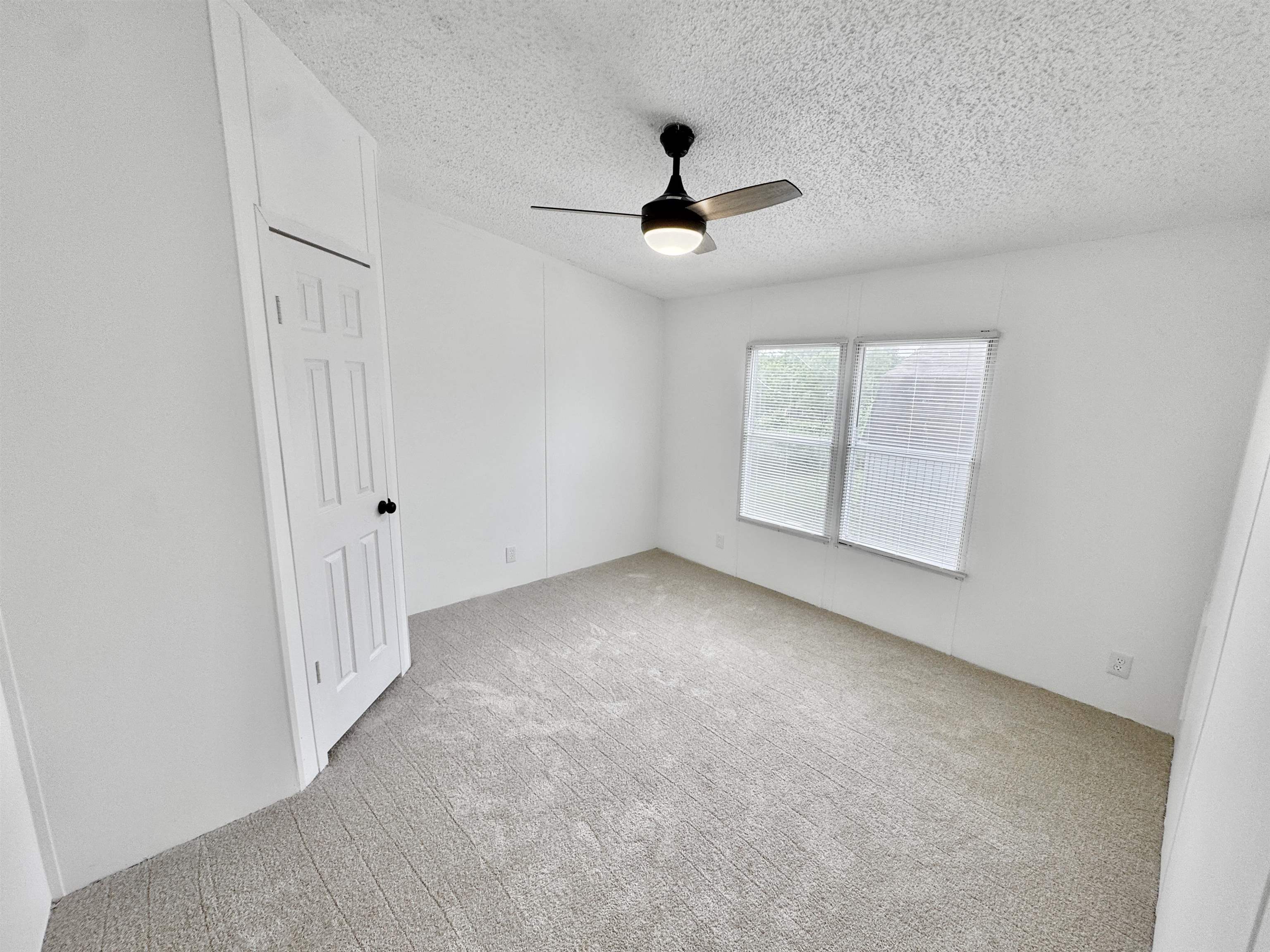 841 Simmons Road Drummonds, TN 38023 - Photo 21 of 35 Carpeted spare room with a ceiling fan and a textured ceiling