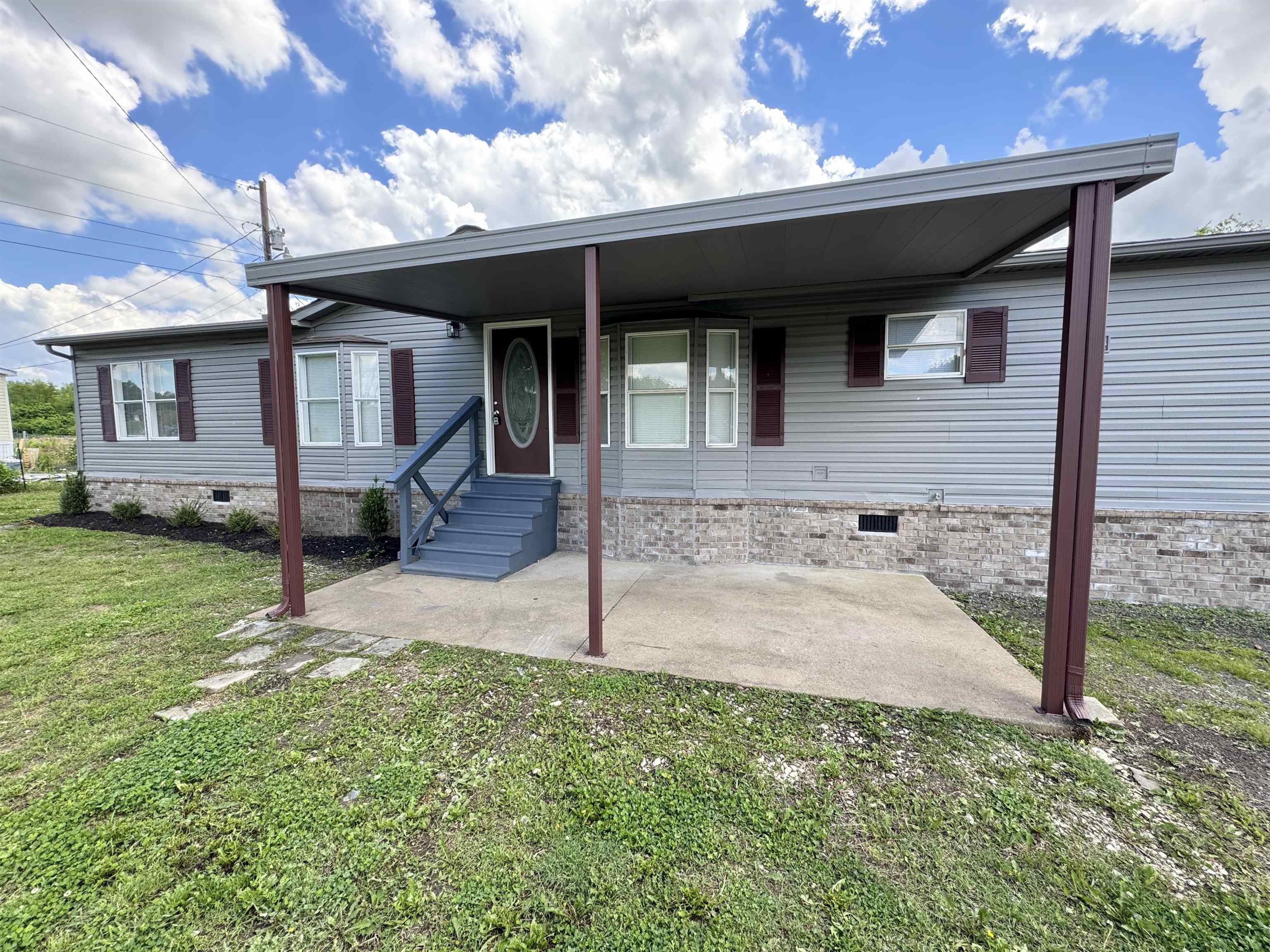 841 Simmons Road Drummonds, TN 38023 - Photo 33 of 35 Manufactured / mobile home with crawl space and a front yard