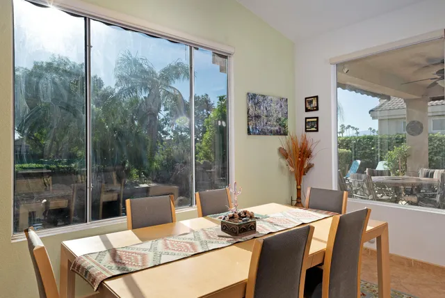 a view of a dining room with furniture window and outside view