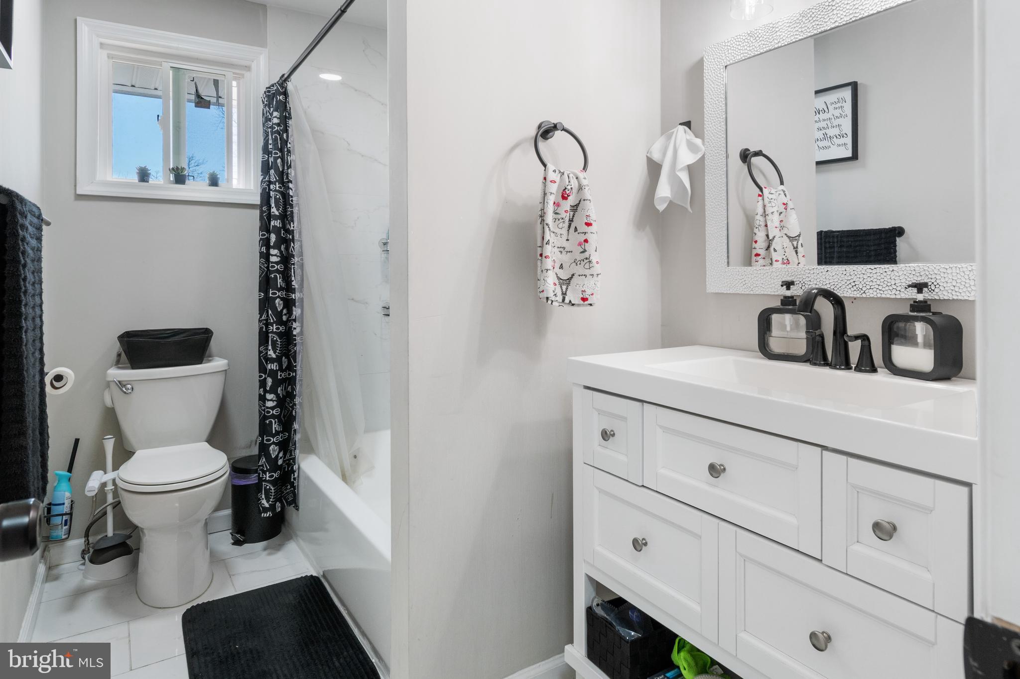 25 Latimer Way Burlington, NJ 08016 - Photo 16 of 28 a bathroom with a toilet sink and mirror