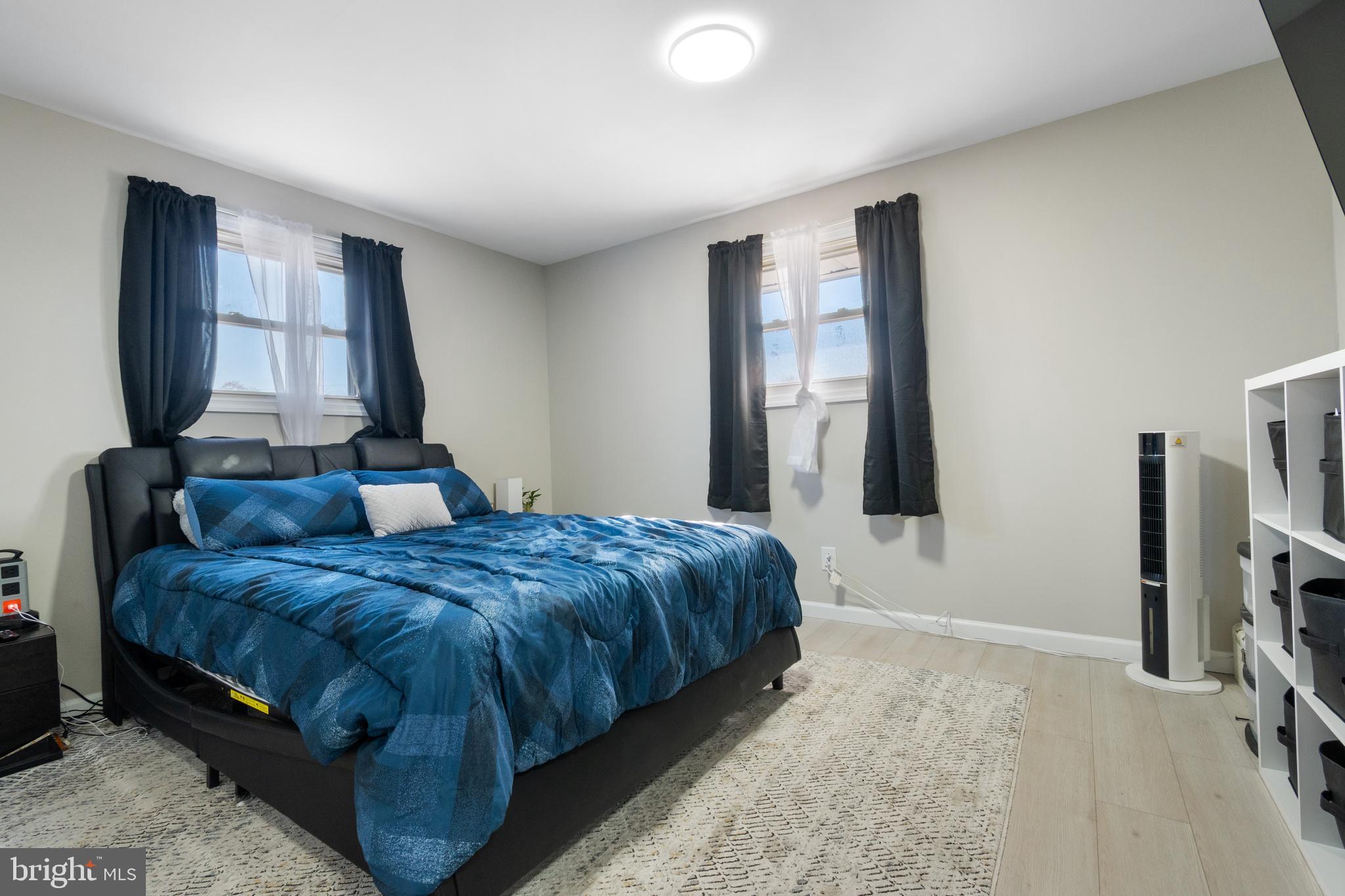 25 Latimer Way Burlington, NJ 08016 - Photo 17 of 28 a bedroom with a bed and a flat screen tv