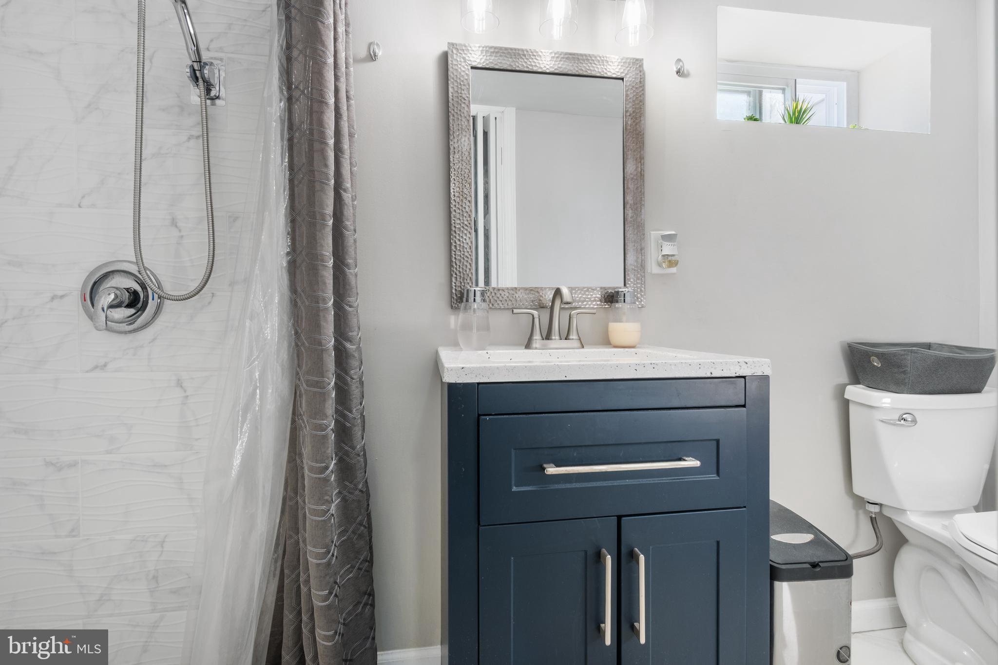 25 Latimer Way Burlington, NJ 08016 - Photo 25 of 28 a bathroom with a sink a toilet and shower