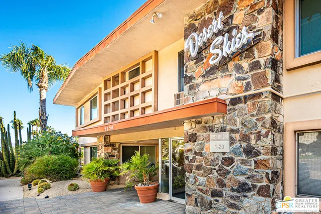 a view of a building with potted plants