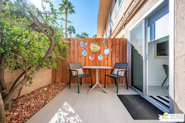 a dining room with a table and chairs