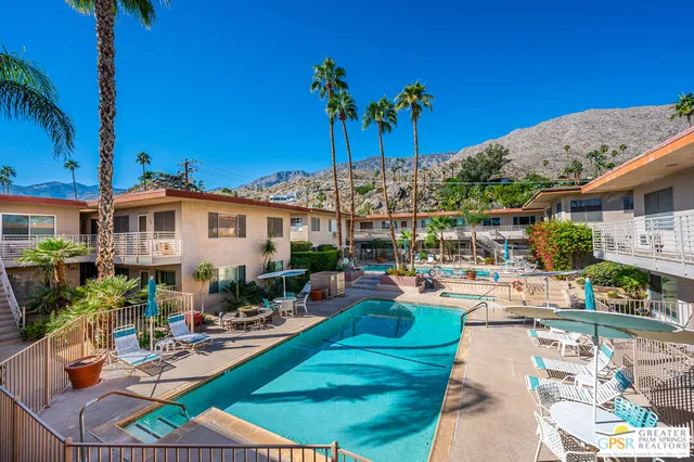 a front view of a building with sitting area