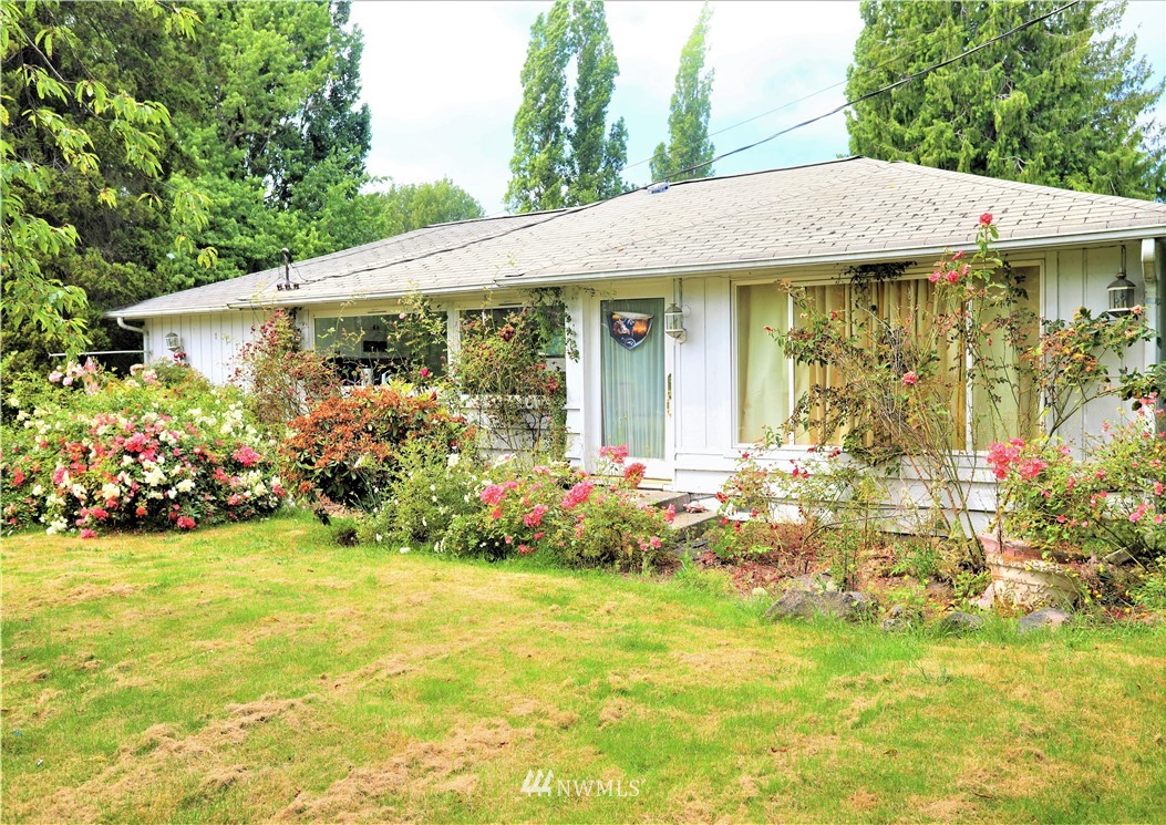 11204 Southeast Petrovitsky Road Renton, WA 98055 - Photo 1 of 37 a view of a house with swimming pool