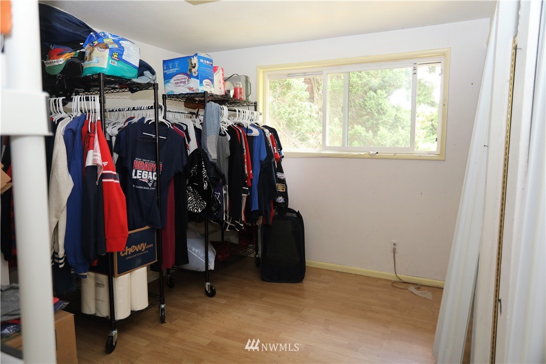 11204 Southeast Petrovitsky Road Renton, WA 98055 - Photo 17 of 37 a view of walk in closet with clothes and shoes