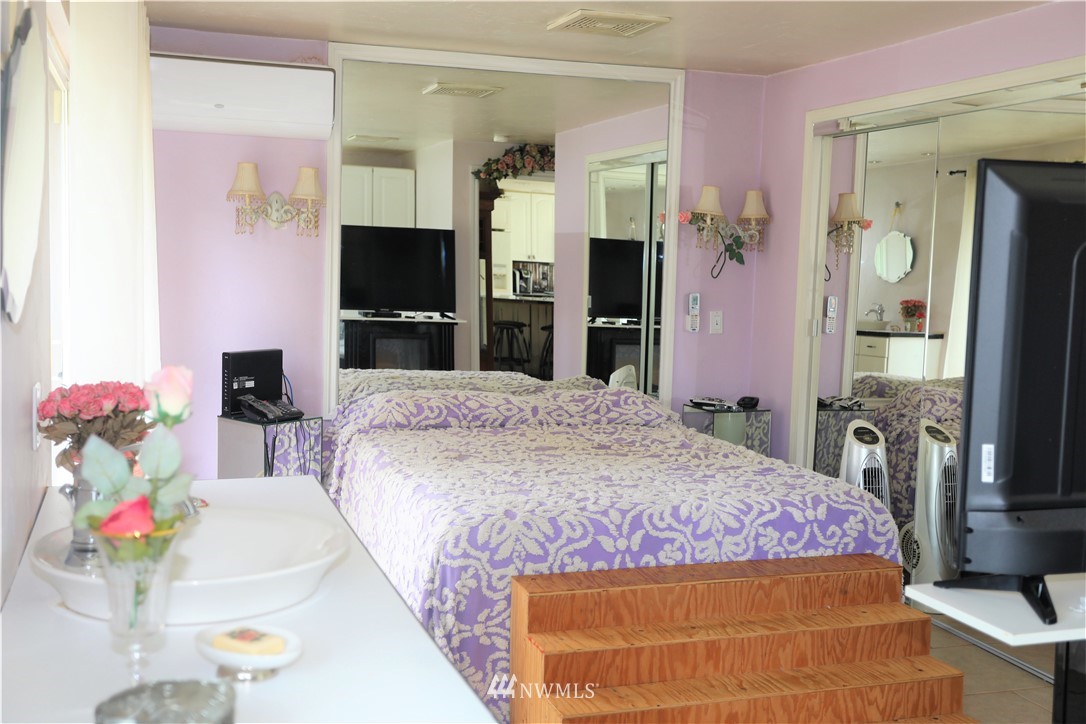 11204 Southeast Petrovitsky Road Renton, WA 98055 - Photo 21 of 37 a bedroom with a bed and a flat screen tv