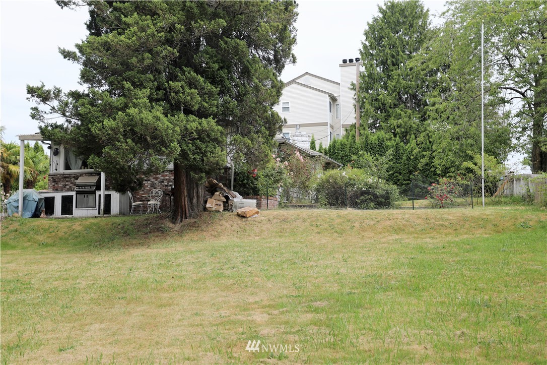 11204 Southeast Petrovitsky Road Renton, WA 98055 - Photo 27 of 37 a view of a house with a yard
