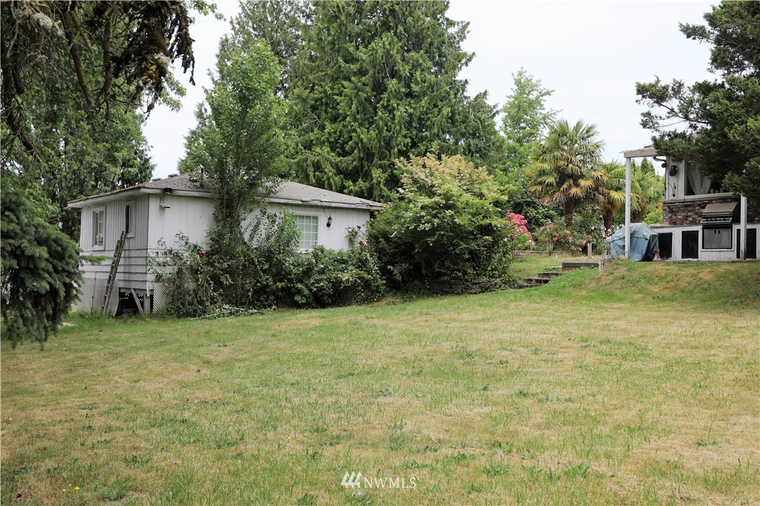 11204 Southeast Petrovitsky Road Renton, WA 98055 - Photo 28 of 37 a house with trees in front of it