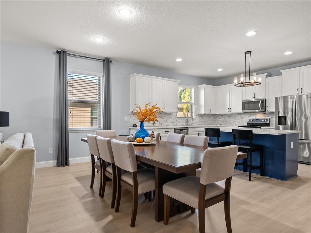 30021 Donnington Loop Mount Dora, FL 32757 - Photo 13 of 40 a view of a dining room with furniture