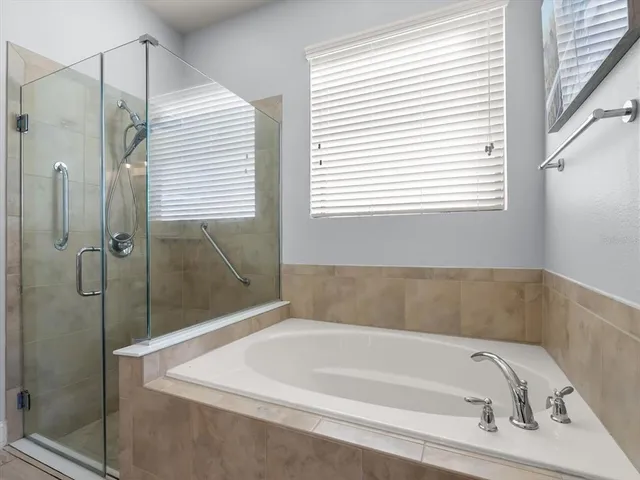 a white bath tub sitting next to a window