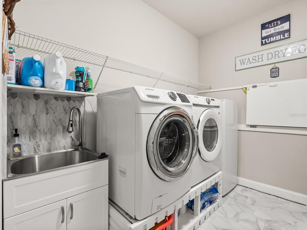 30021 Donnington Loop Mount Dora, FL 32757 - Photo 28 of 40 a utility room with dryer and washer