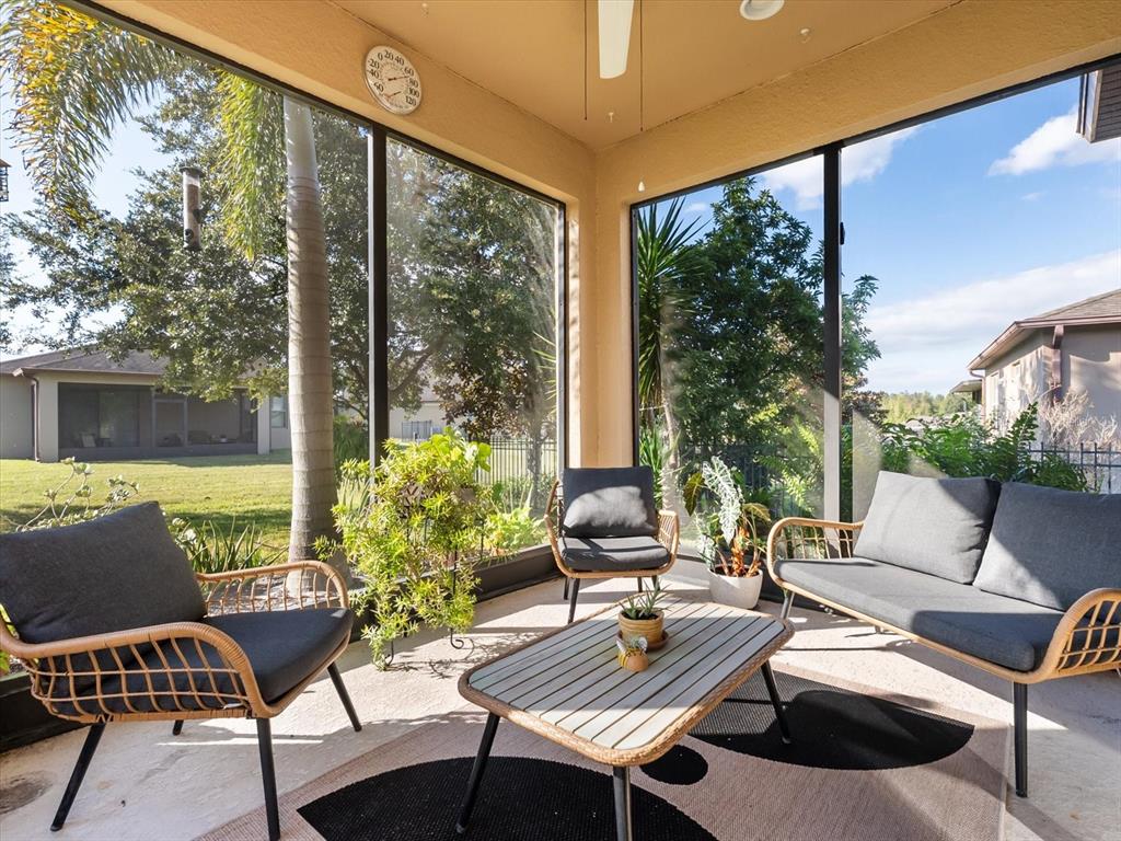 30021 Donnington Loop Mount Dora, FL 32757 - Photo 29 of 40 a view of a patio with couches chairs and a potted plant