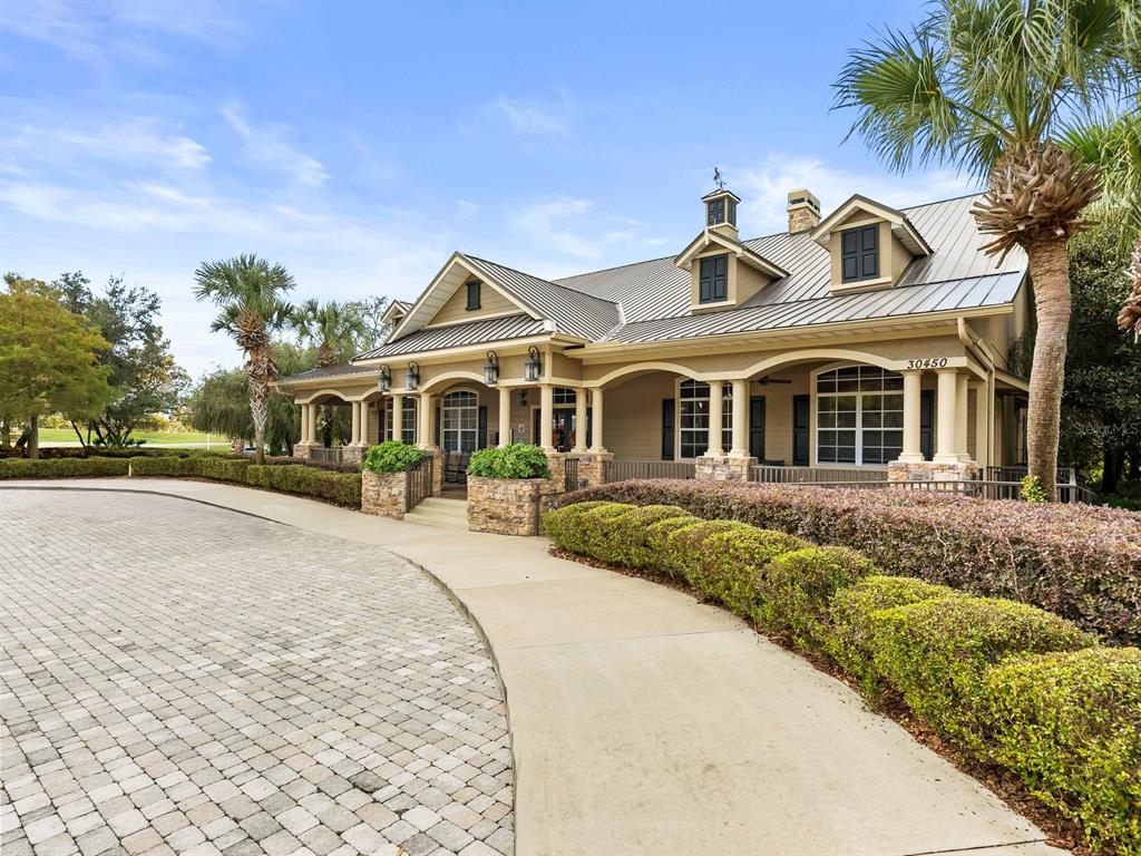 30021 Donnington Loop Mount Dora, FL 32757 - Photo 34 of 40 a front view of a house with a garden