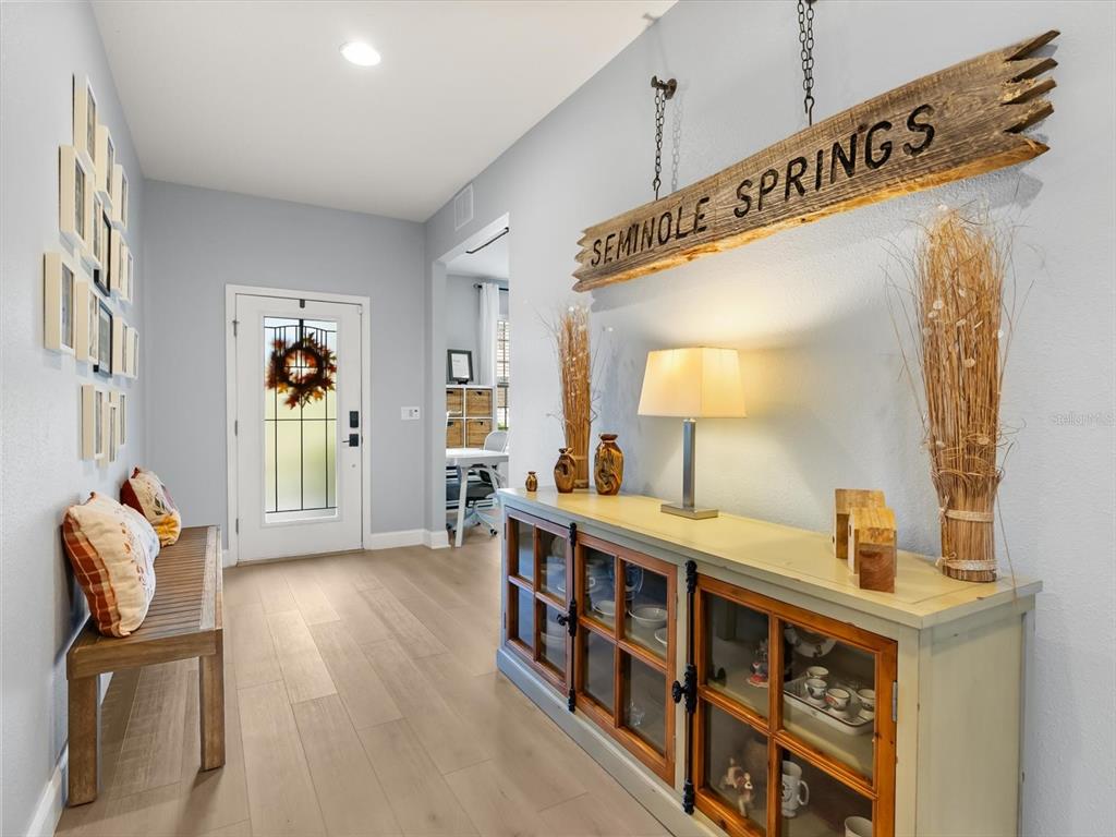 30021 Donnington Loop Mount Dora, FL 32757 - Photo 4 of 40 a living room with furniture and a wooden floor