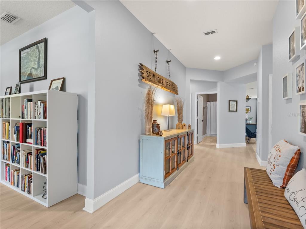 30021 Donnington Loop Mount Dora, FL 32757 - Photo 5 of 40 a view of a hallway with windows