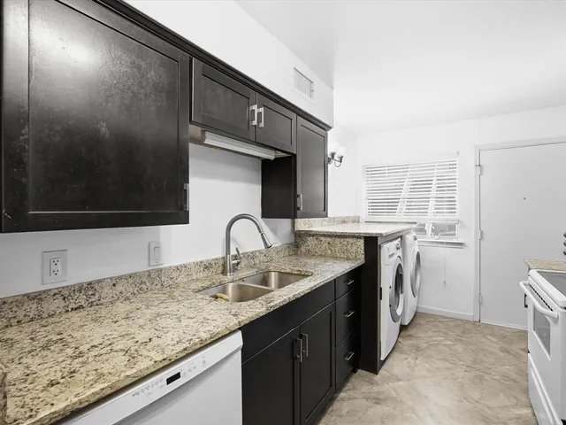 a kitchen with a sink and a stove