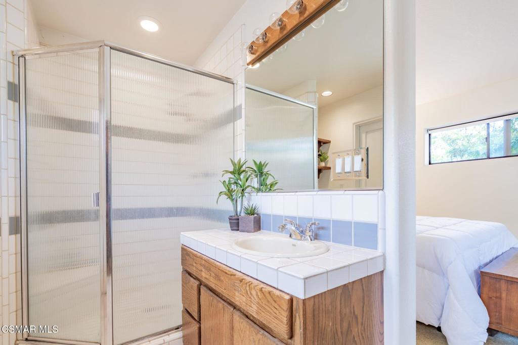 6078 Peppertree Lane Simi Valley, CA 93063 - Photo 40 of 59 a bathroom with a sink and a mirror