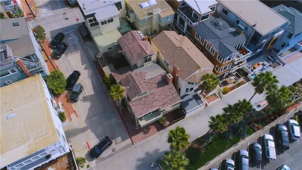 an aerial view of a house with outdoor space