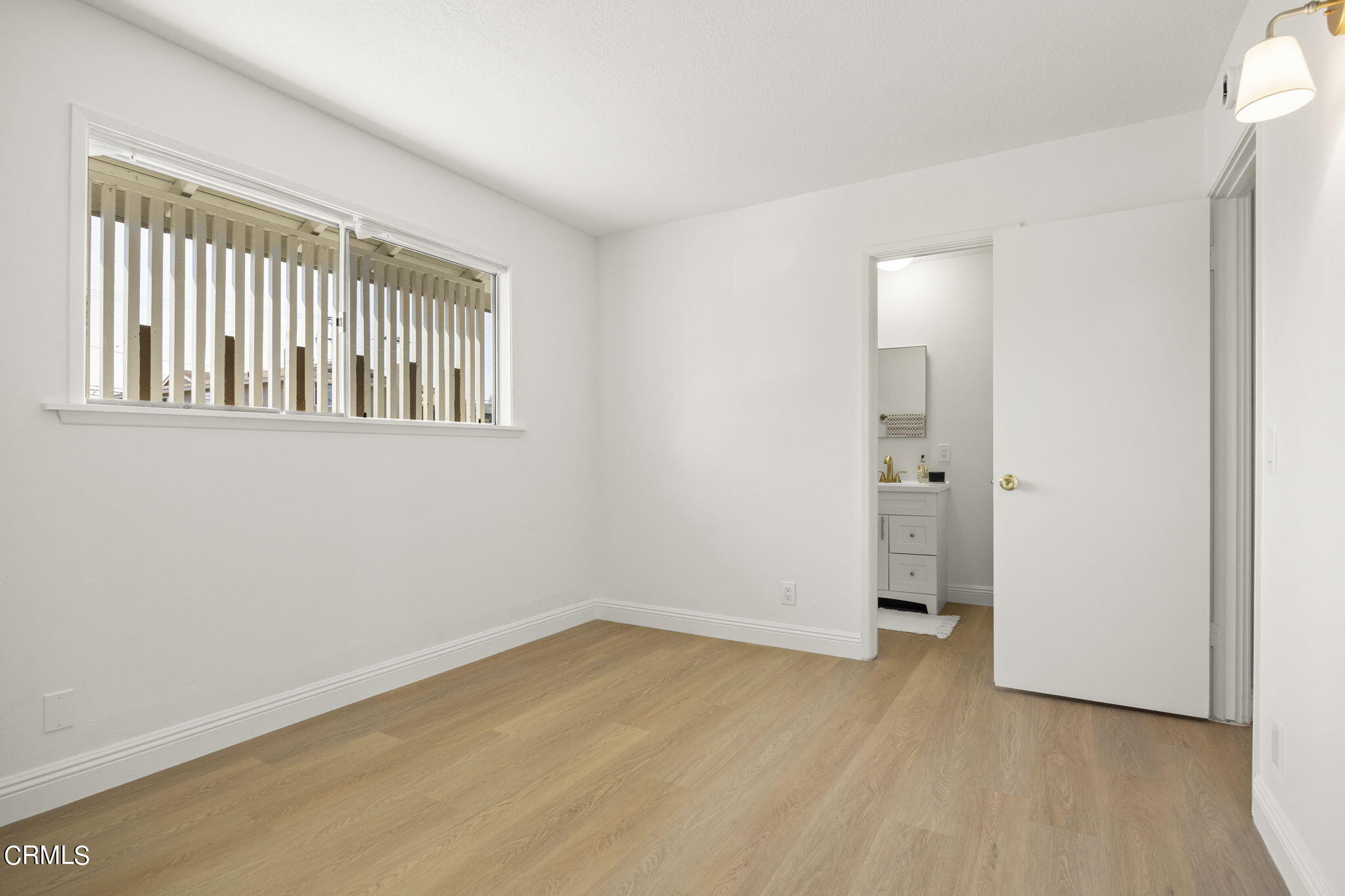 1225 Azalea Street Oxnard, CA 93036 - Photo 16 of 41 a view of an empty room with a window