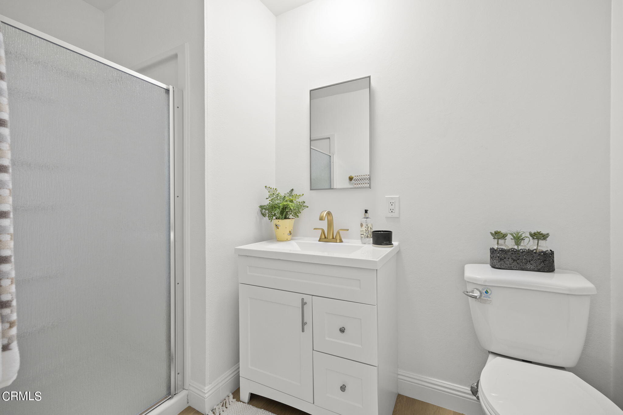 1225 Azalea Street Oxnard, CA 93036 - Photo 18 of 41 a bathroom with a sink a toilet and vanity