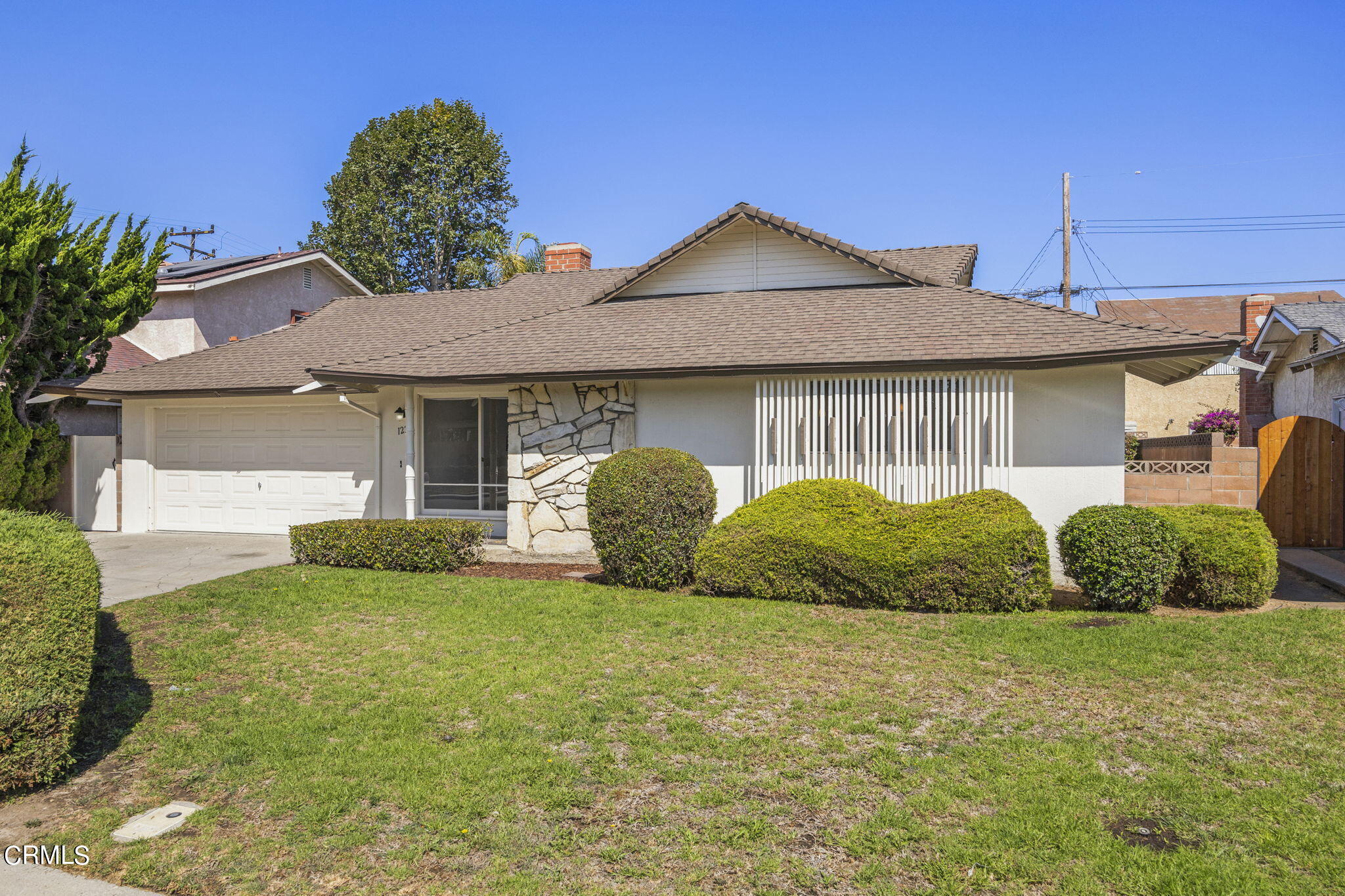 1225 Azalea Street Oxnard, CA 93036 - Photo 2 of 41 a front view of a house with garden