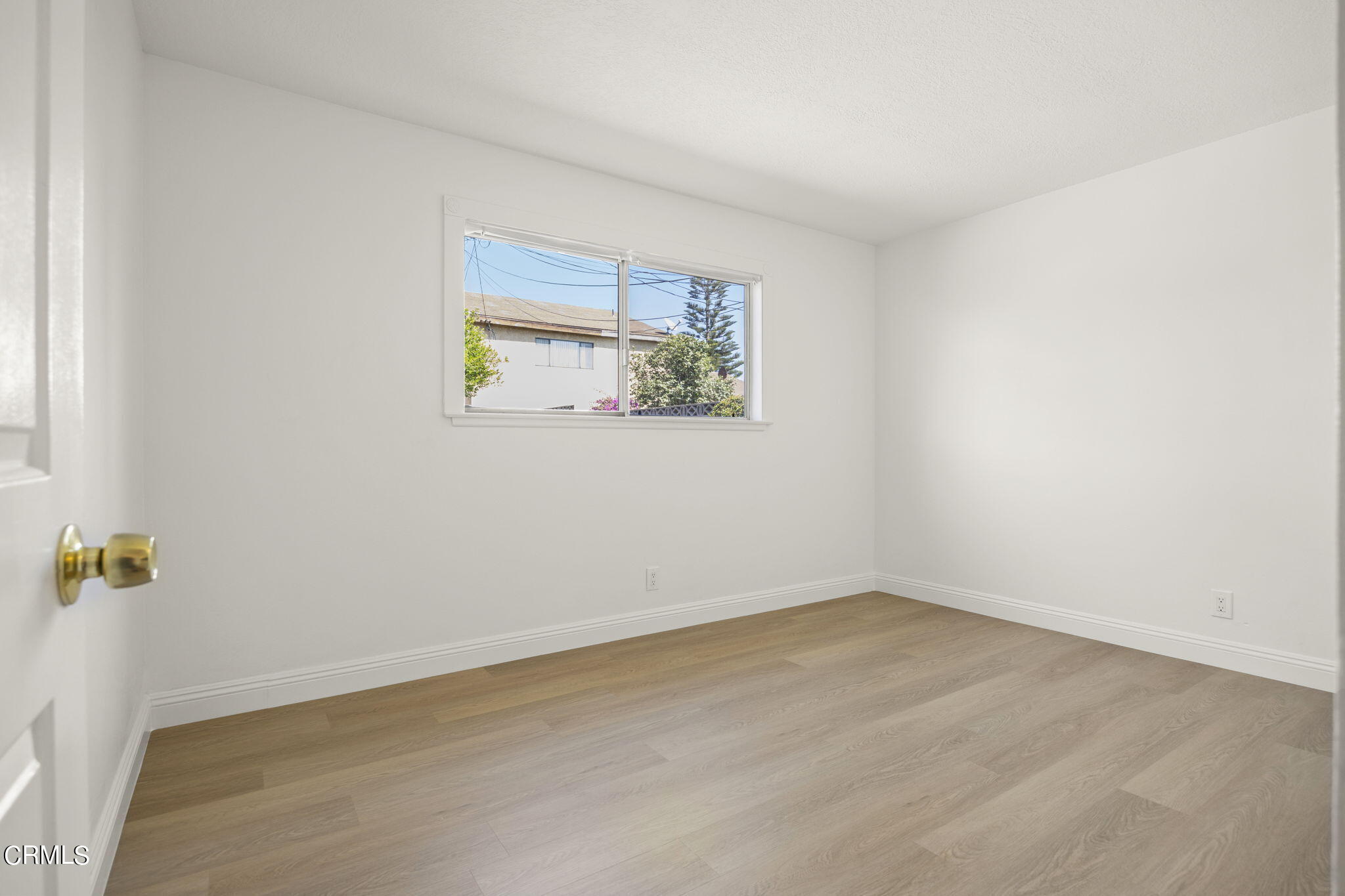 1225 Azalea Street Oxnard, CA 93036 - Photo 21 of 41 an empty room with a window