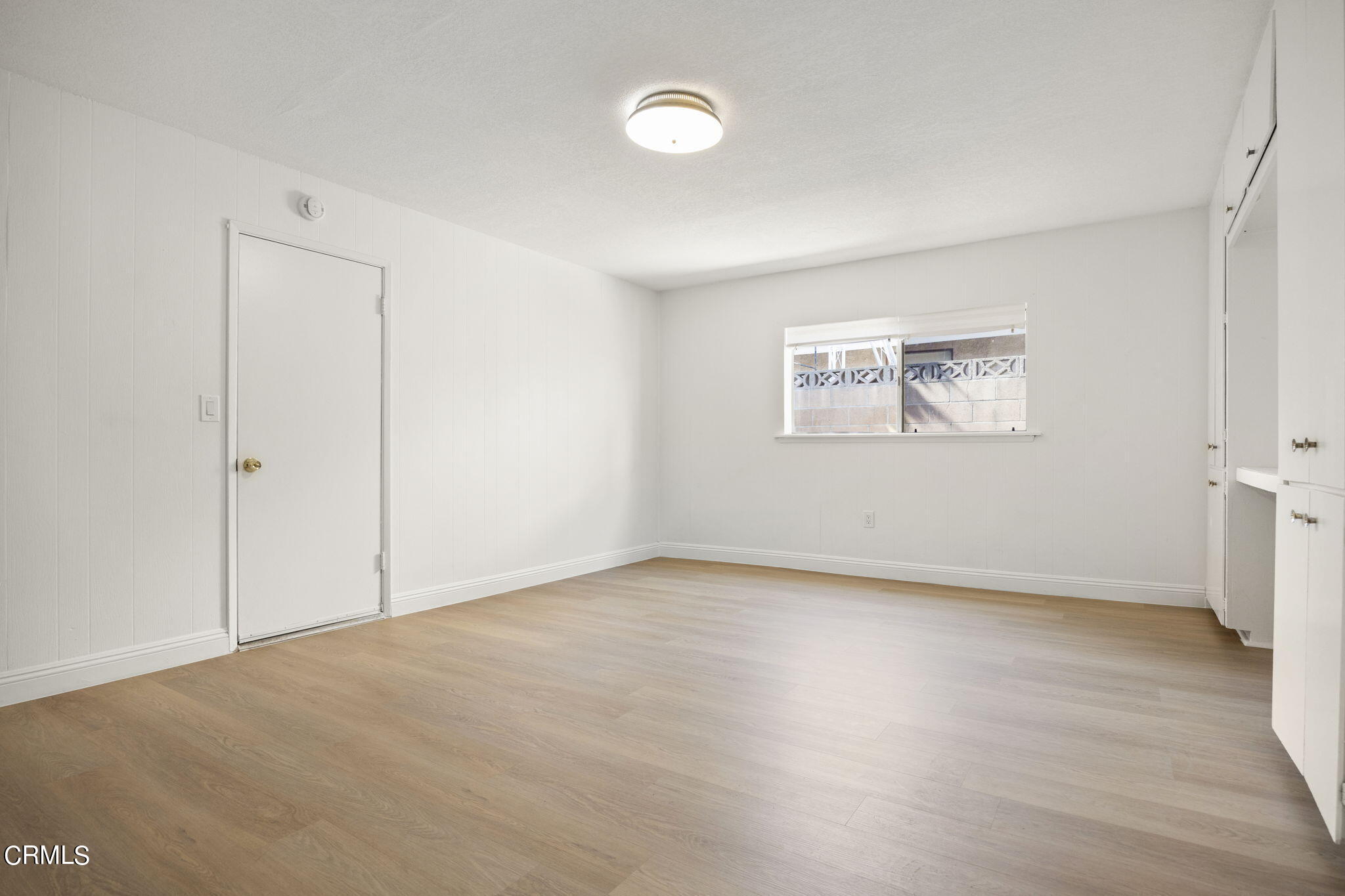 1225 Azalea Street Oxnard, CA 93036 - Photo 25 of 41 an empty room with windows and closet