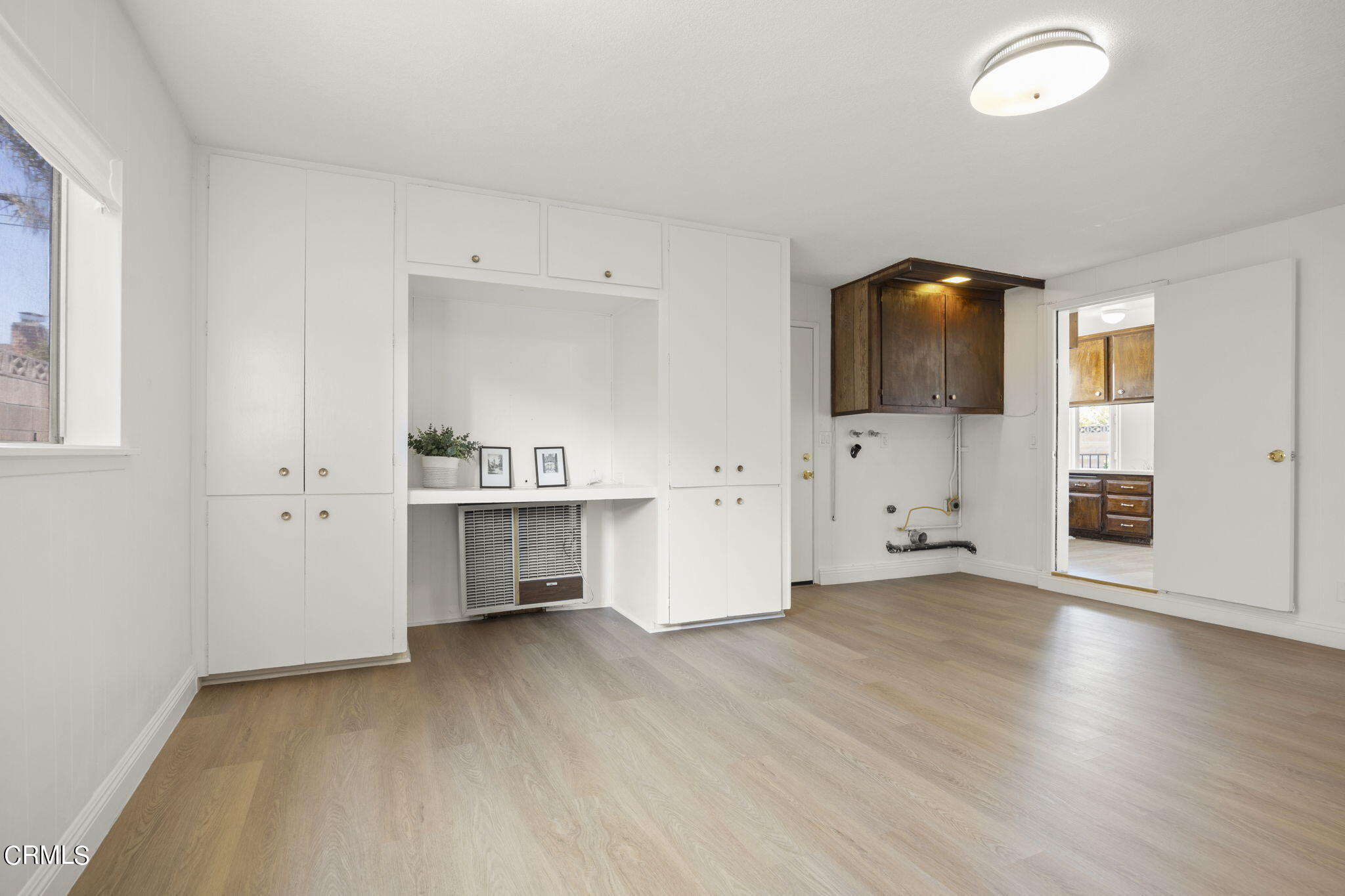 1225 Azalea Street Oxnard, CA 93036 - Photo 27 of 41 an empty room with furniture and wooden floor