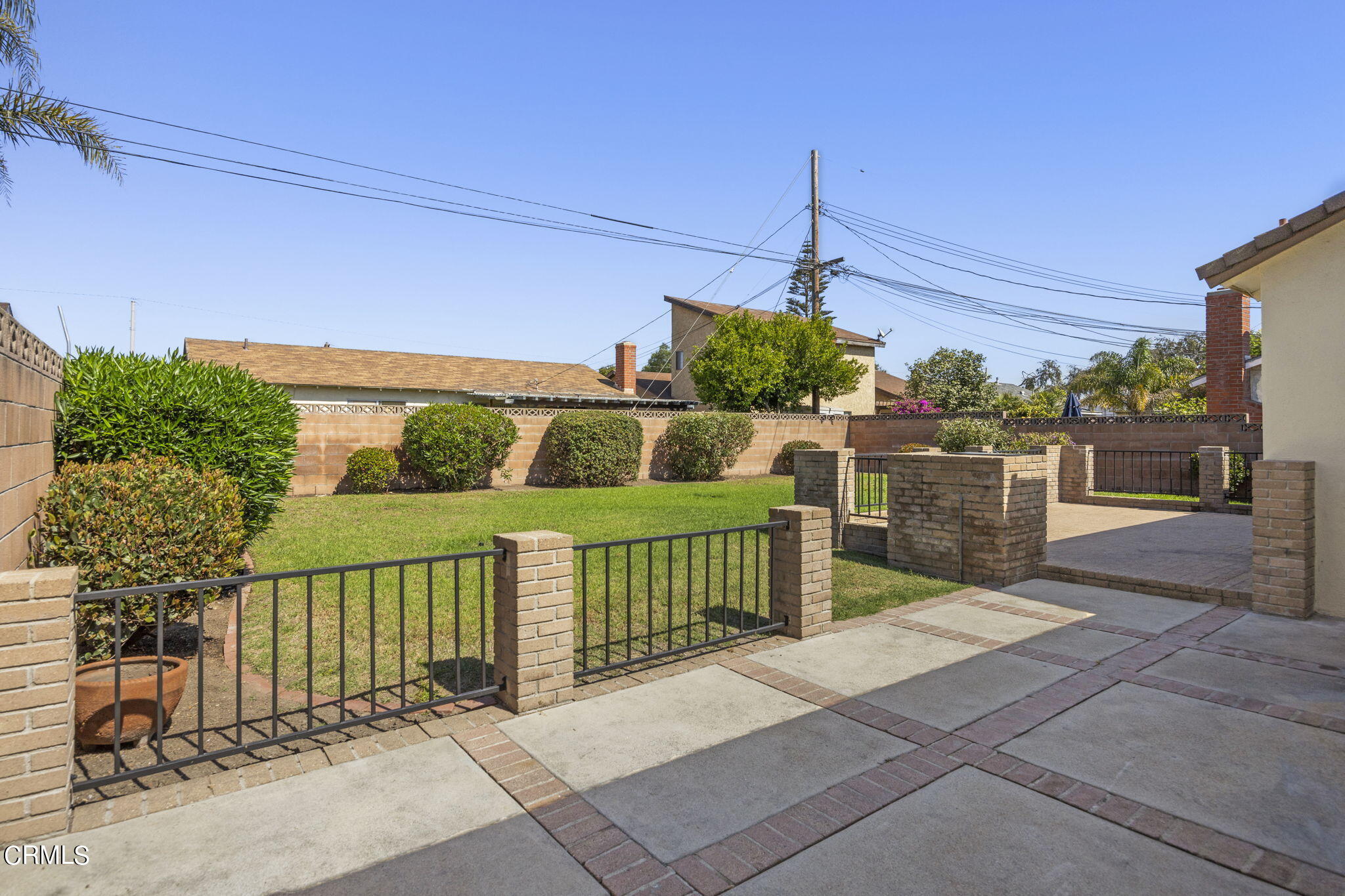 1225 Azalea Street Oxnard, CA 93036 - Photo 29 of 41 a view of a chairs and table in the back yard of the house
